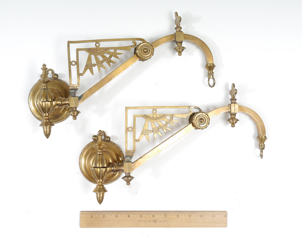 Appraisal: PAIR AESTHETIC MOVEMENT BRASS PLANT HANGERS Wall mounted hinged shaft