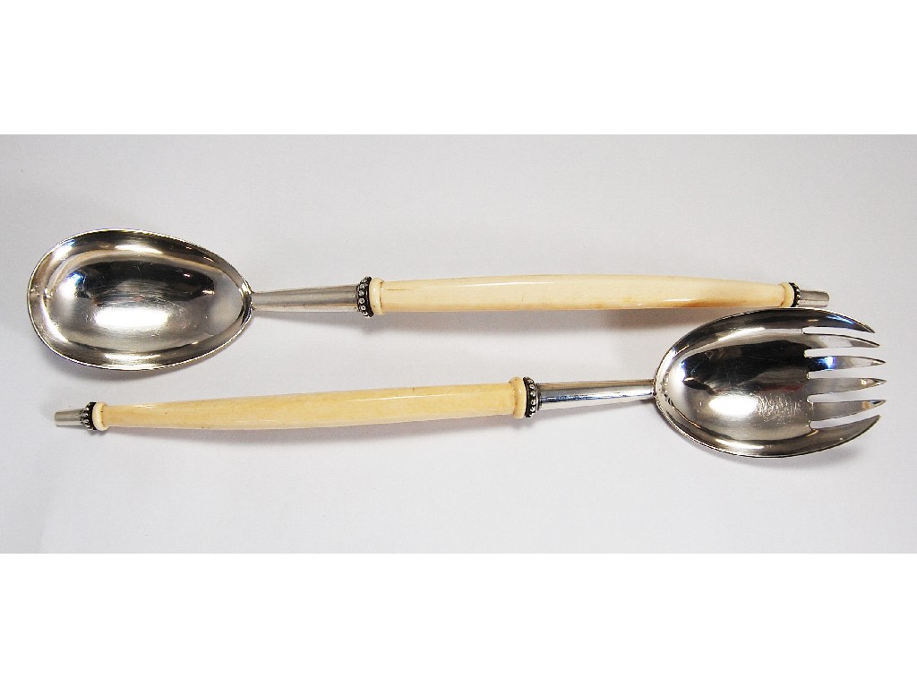 Appraisal: Pair of unusual Victorian salad servers having long curved ivory