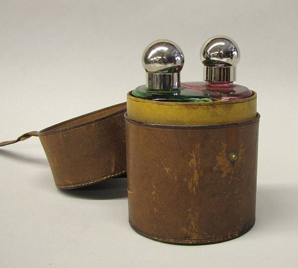 Appraisal: A pair of cased spirit bottles comprising red and green