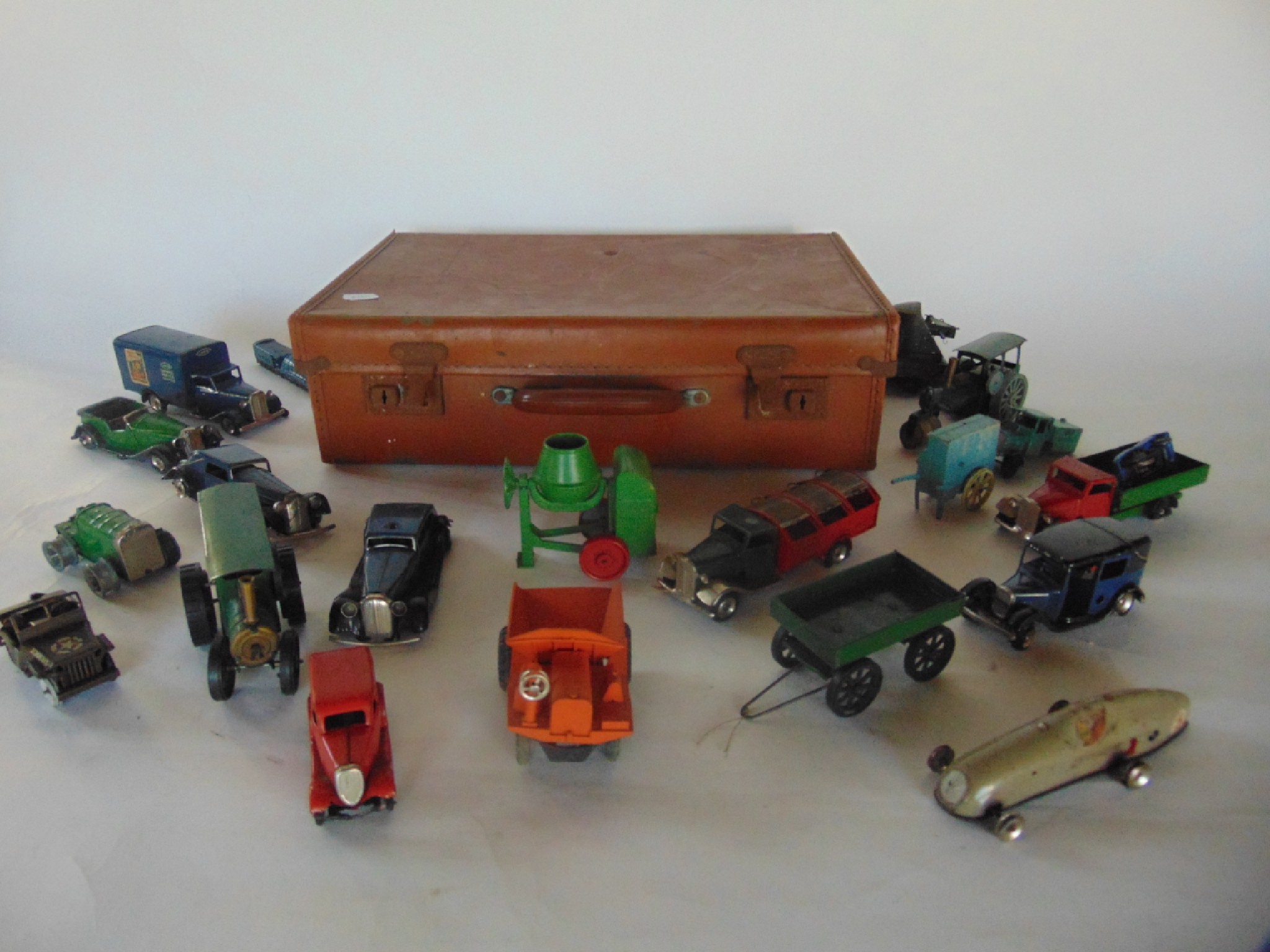 Appraisal: A small stitched composite suitcase containing selected vintage diecast models