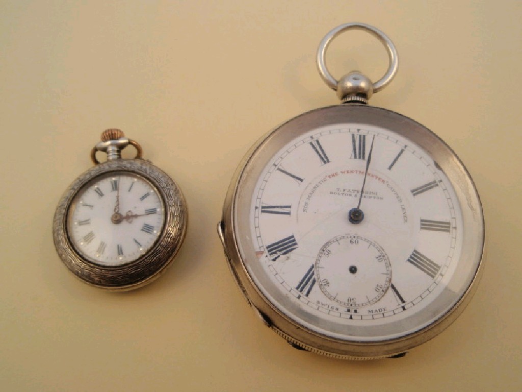 Appraisal: An open faced silver pocket watch and a ladies silver