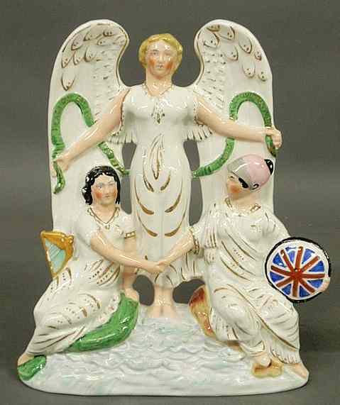 Appraisal: Staffordshire th c centerpiece Peace of an angel standing behind