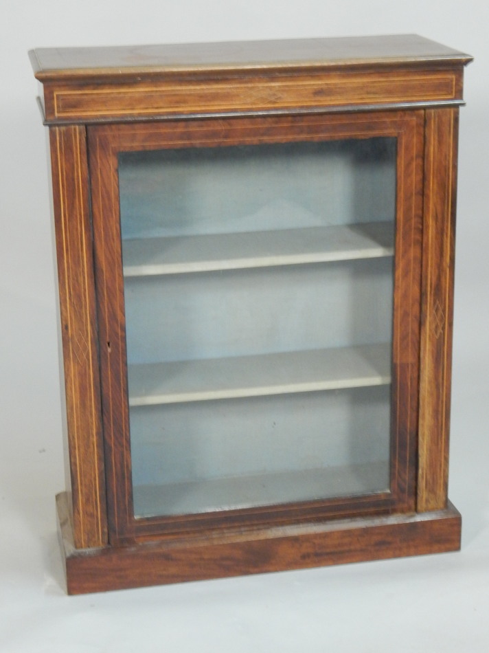 Appraisal: A Victorian walnut and boxwood strung pier cabinet the top