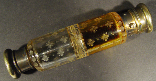 Appraisal: Floral engraved double ended glass scent bottle with silver metal