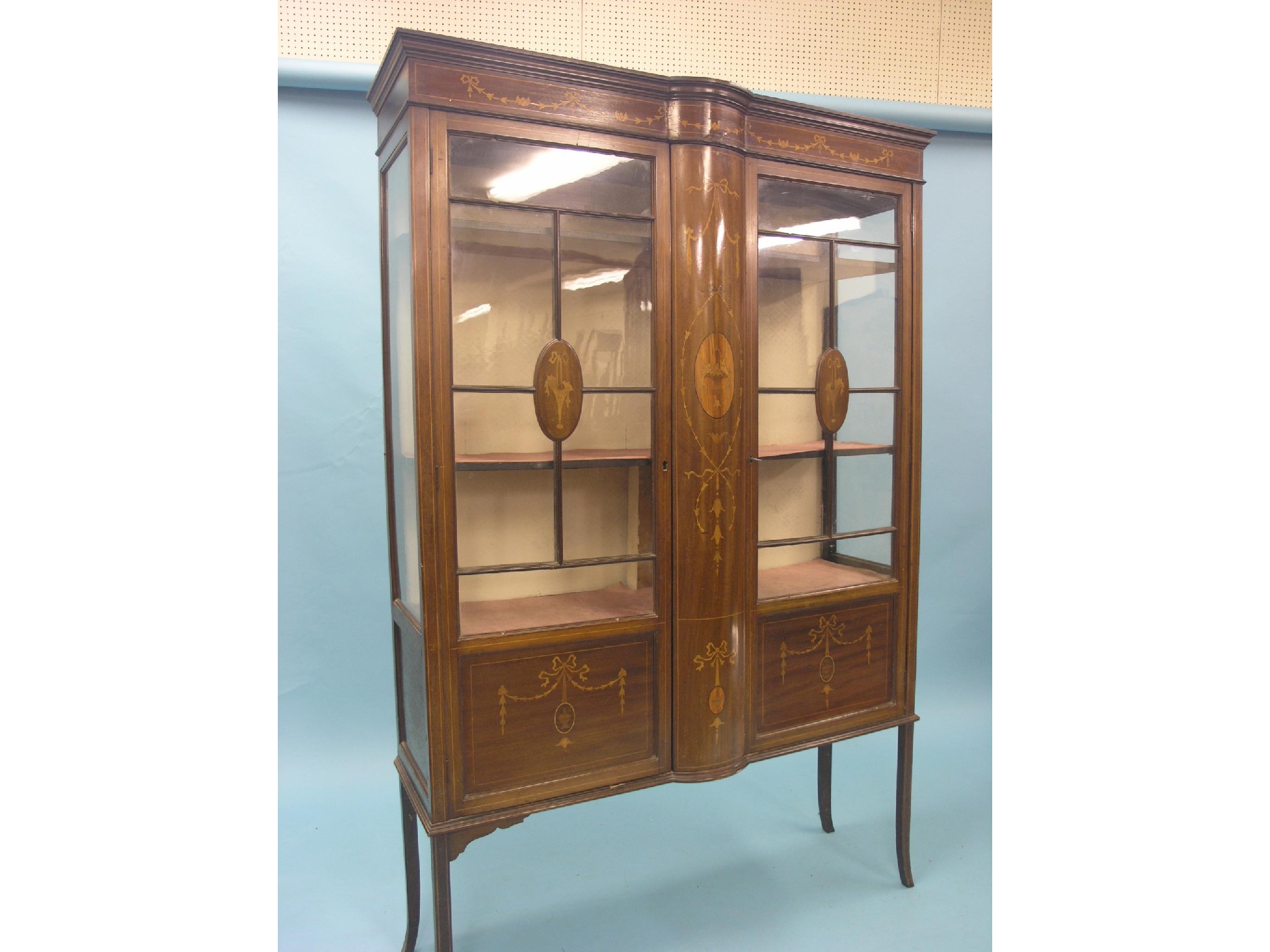 Appraisal: An Edwardian inlaid mahogany display cabinet pair of astragal-glazed doors