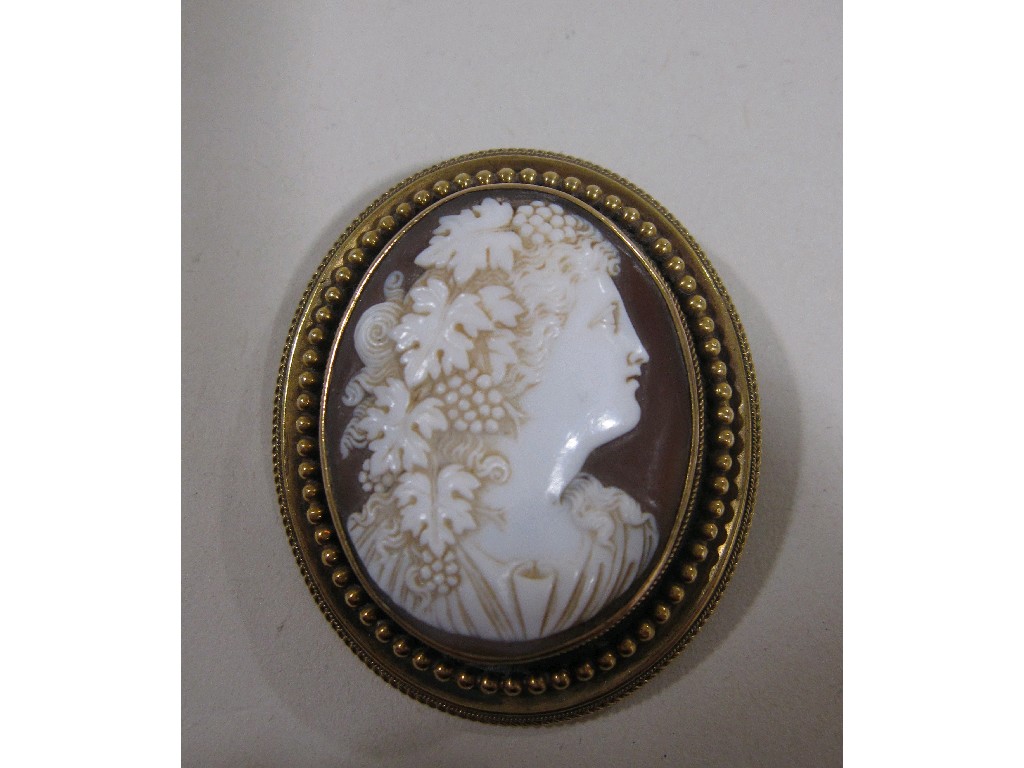 Appraisal: Cameo brooch depicting a maiden in floral head dress in