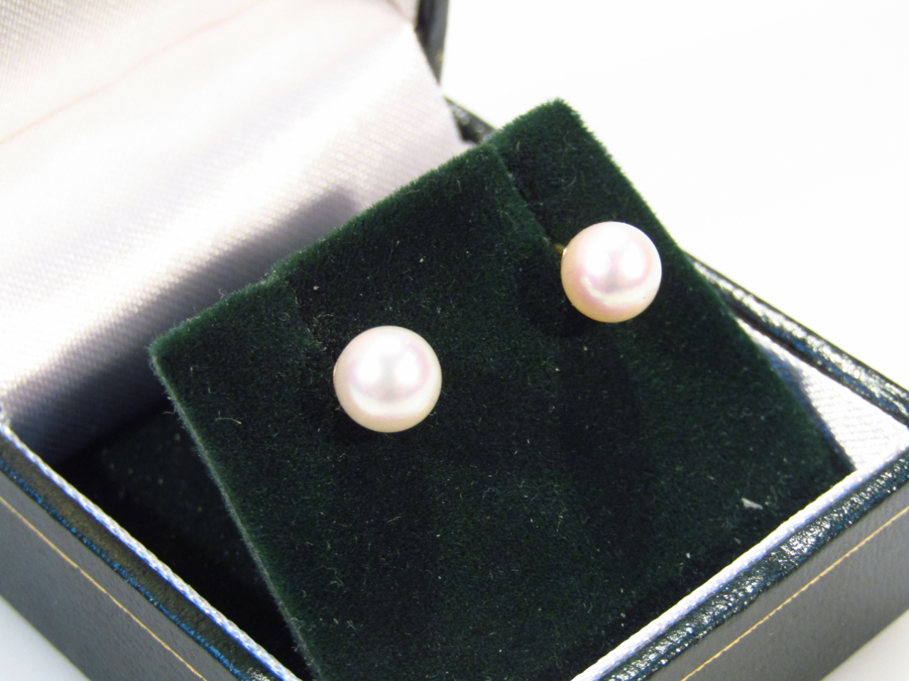 Appraisal: A pair of pearl ear studs with yellow metal ends