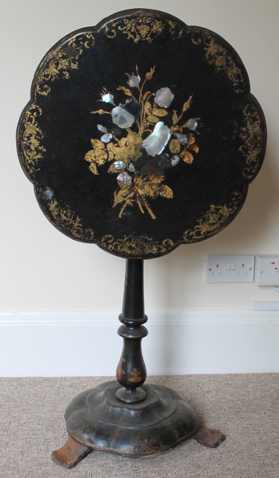 Appraisal: A Victorian papier mache centre table with mother of pearl