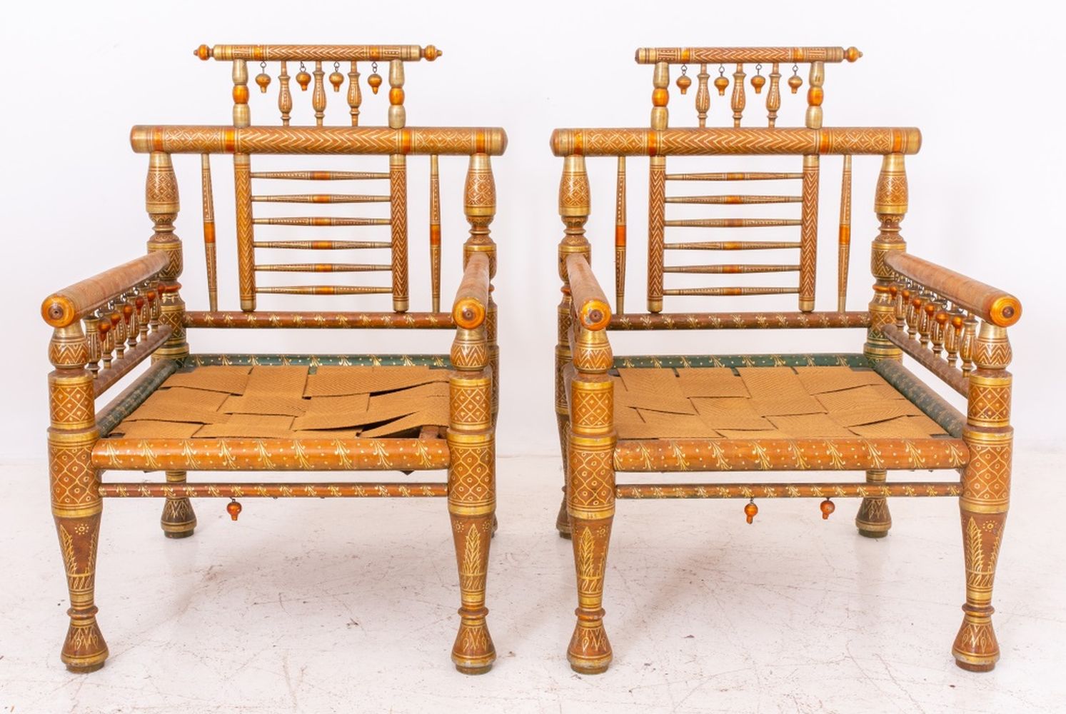 Appraisal: ANGLO-INDIAN SANKHEDA POLYCHROME GILT ARMCHAIRS Anglo-Indian Sankheda polychrome and parcel-gilded