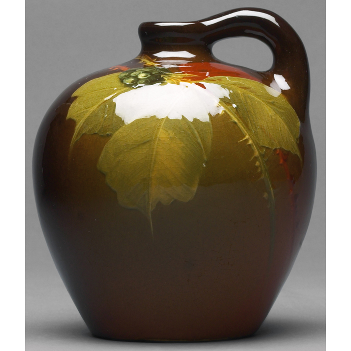 Appraisal: Weller Louwelsa handled vessel bulbous shape in a brown glaze