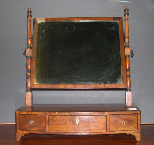 Appraisal: Attractive Georgian Parcel-Ebonized Mahogany Bowfront Three-Drawer Swing Shaving Mirror in