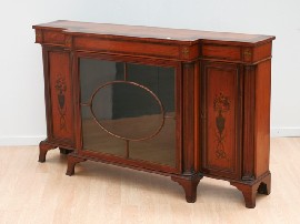 Appraisal: A Sheraton revival satinwood and rosewood breakfront cabinet with painted