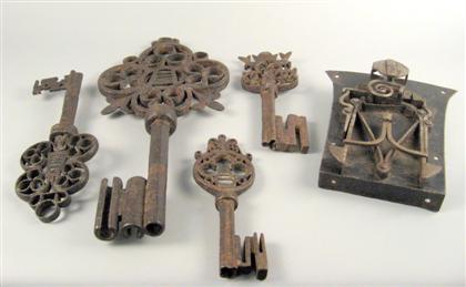 Appraisal: Four Baroque style wrought iron keys Each with scrolled decoration