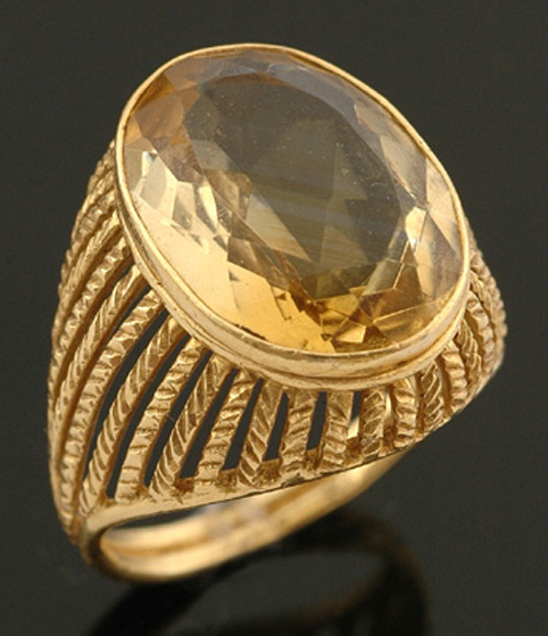 Appraisal: A citrine cocktail ring The oval citrine weighing cts bezel