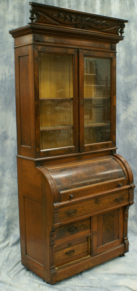 Appraisal: Walnut Victorian cylinder roll secretary desk with carved crest original