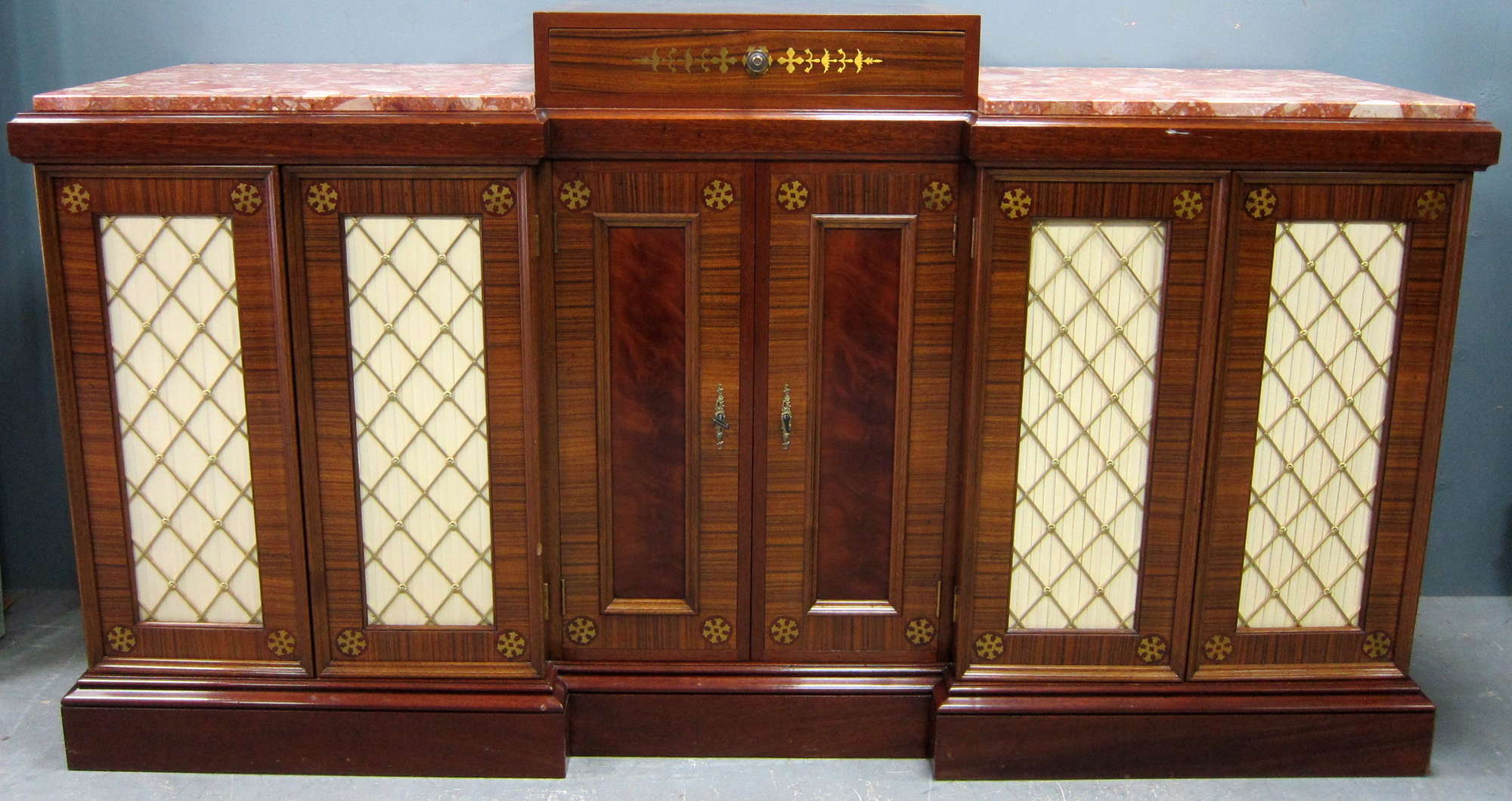 Appraisal: Reproduction mahogany inverted breakfront sideboard with marble insert tops and