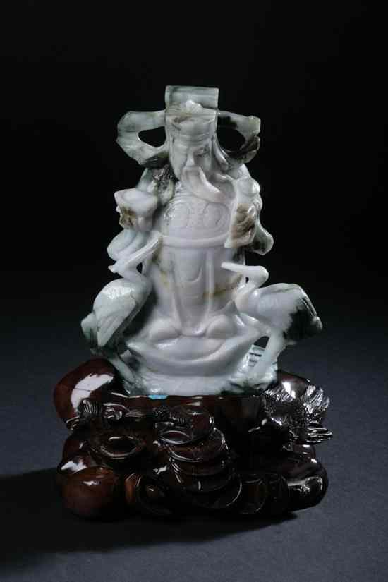 Appraisal: CHINESE CELADON AND DARK GREEN JADE FIGURE OF WARRIOR Carved