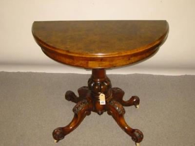 Appraisal: A VICTORIAN BURR WALNUT FOLDING CARD TABLE of demi lune