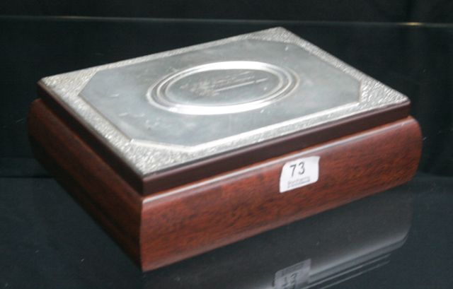 Appraisal: A timber and tin jewellery box inscribed 'The Hellenic Parliament'