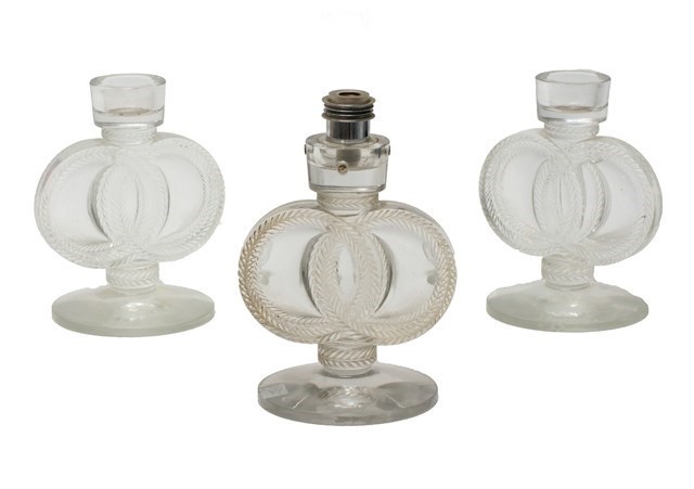 Appraisal: Three Lalique candlesticks 'St James' design No designed one converted