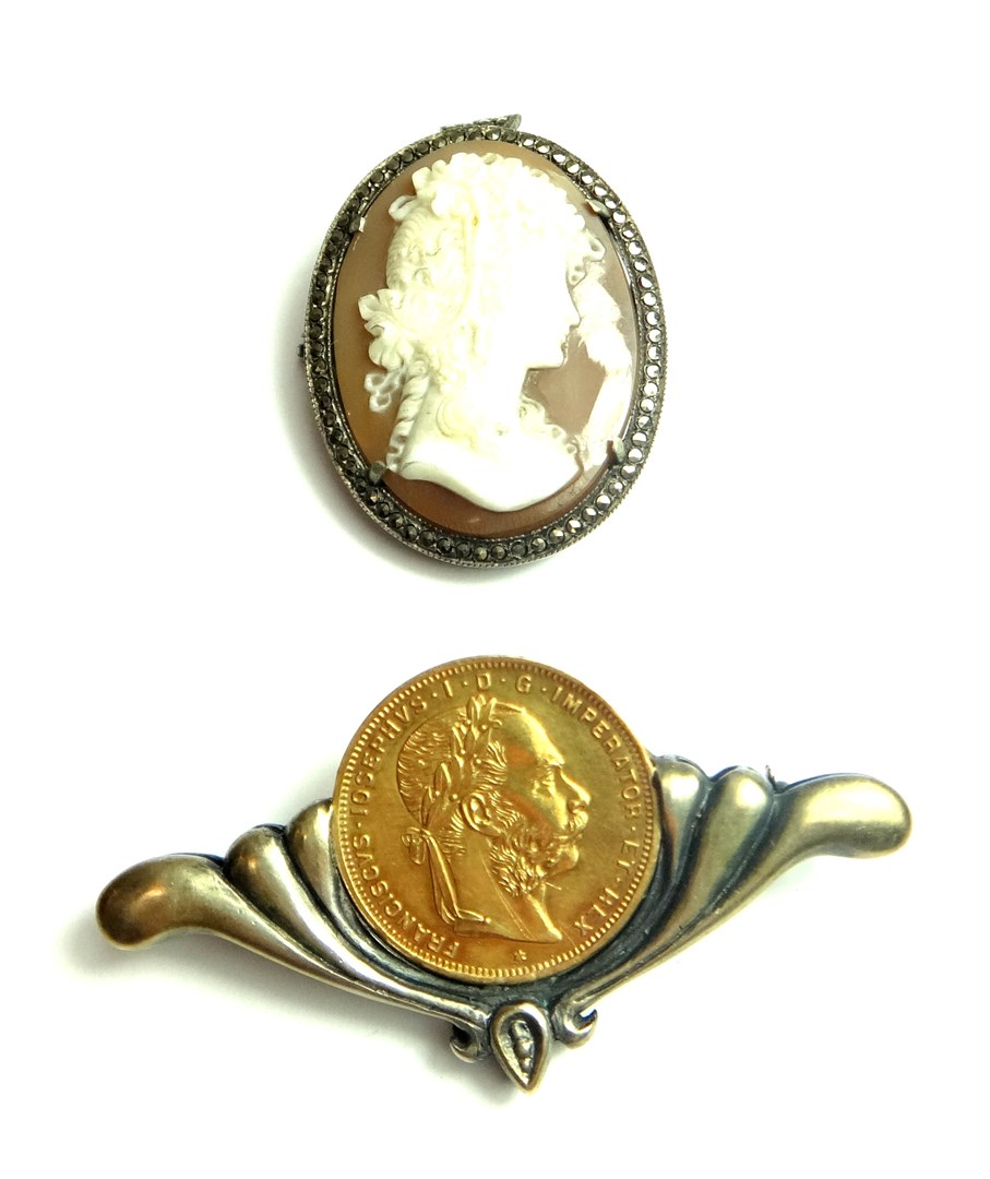 Appraisal: An Austrian gold twenty francs mounted as a brooch and