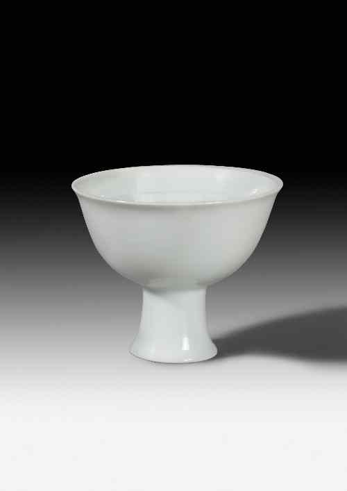 Appraisal: A Chinese porcelain white glazed stem cup the interior moulded