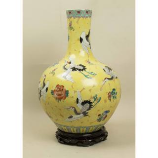 Appraisal: Chinese Yellow Vase Chinese yellow vase with wooden stand Vase