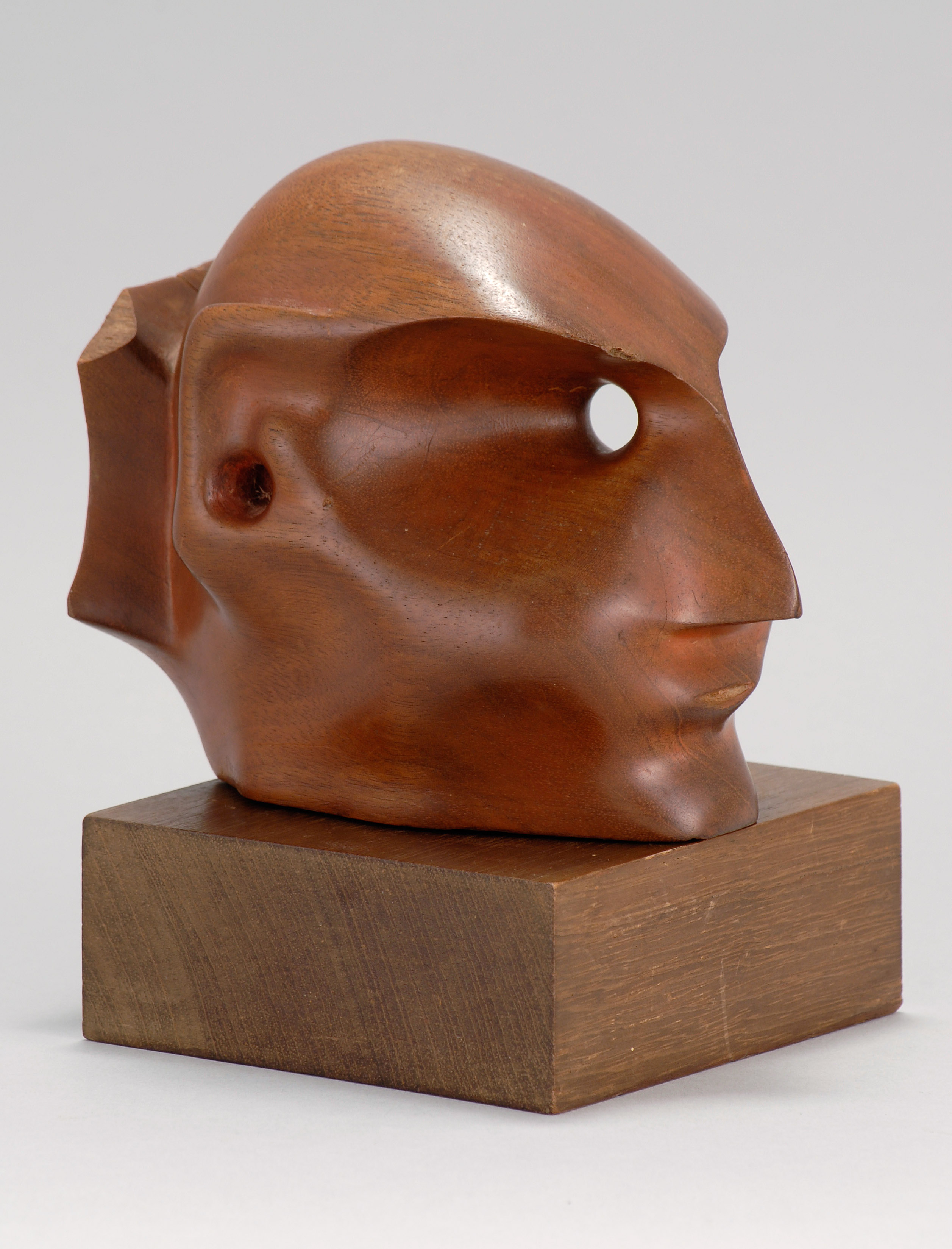 Appraisal: ATTRIBUTED TO ELIZABETH CATLETTAmerican - A head Unsigned Wood sculpture