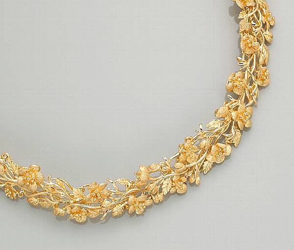 Appraisal: A fourteen karat gold floral motif collar necklace weighing approximately