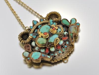 Appraisal: A Silver and Turquoise Pendant on Chain Ethnic design resembling