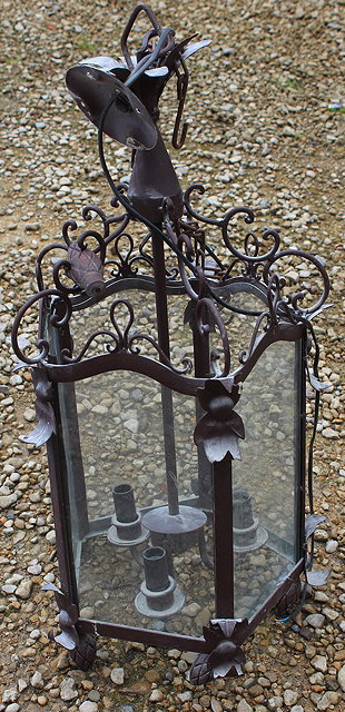 Appraisal: A BROWN PAINTED FIVE LIGHT HALL LANTERN with scrolling supports