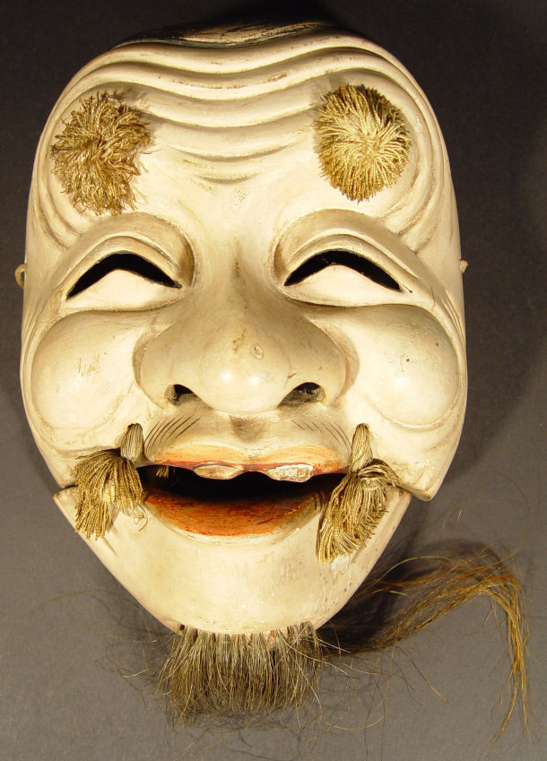 Appraisal: Oriental carved hardwood mask with strung articulated jaw hand painted