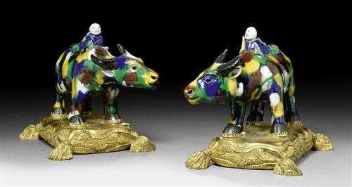 Appraisal: PAIR OF PORCELAIN BUFFALOS ON A BRONZE PLINTH Louis XV