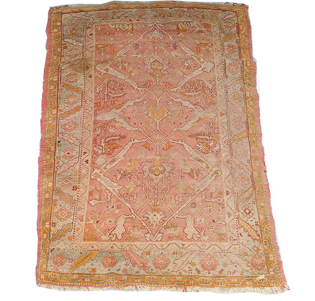 Appraisal: A TURKEY OUSHAK RUG with an open interconnecting medallion on