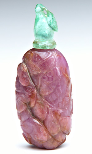 Appraisal: CHINESE SNUFF BOTTLE Precious gemstone bottle of carved ruby decorated