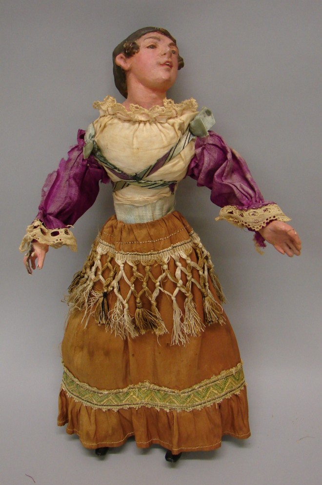 Appraisal: Papier mache lady figure with molded and painted features Cloth