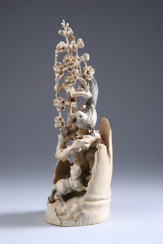 Appraisal: CHINESE CARVED IVORY FIGURAL GROUP th century Cat and bird