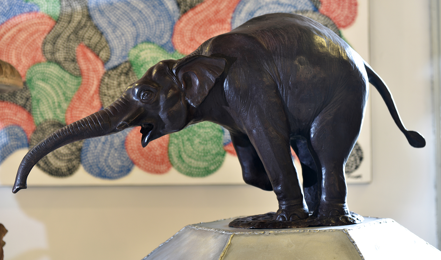 Appraisal: A STOOPING BRONZE ELEPHANT h x w x l