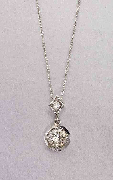 Appraisal: DIAMOND PENDANT NECKLACE K white gold pendant contains one round