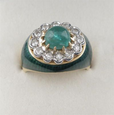 Appraisal: An emerald and diamond cluster ring the cabochon emerald is