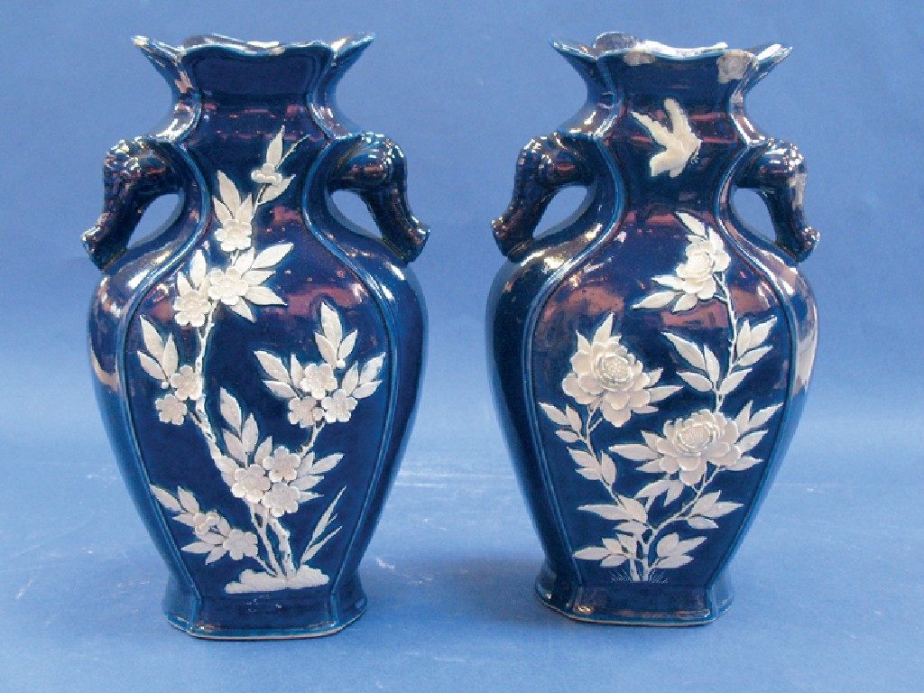 Appraisal: A PAIR OF CHINESE VASES of faceted baluster form moulded