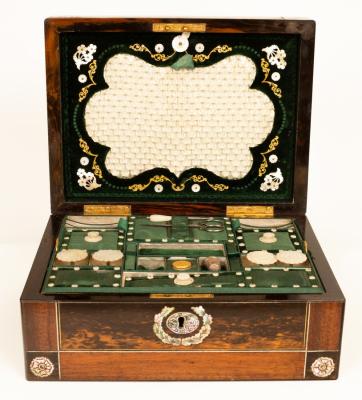 Appraisal: A Regency amboyna and rosewood workbox inlaid a central mother-of-pearl