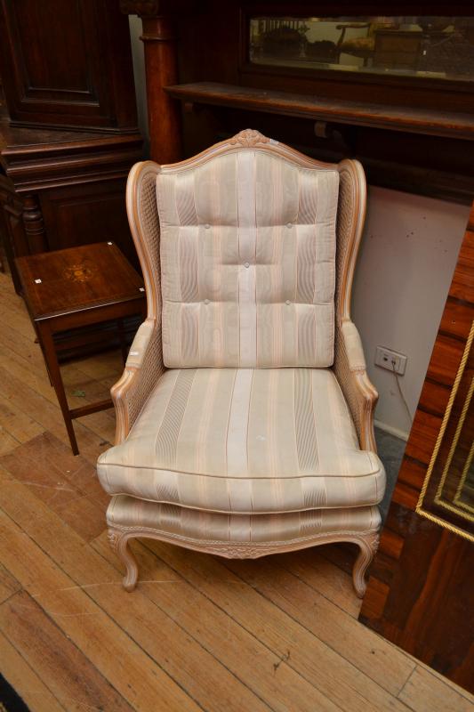 Appraisal: A LOUIS XV STYLE WINGBACK ARMCHAIR WITH RATTAN FRAME A