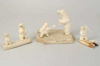 Appraisal: Three Inuit Walrus Ivory Whalebone Carvings Three Inuit walrus ivory