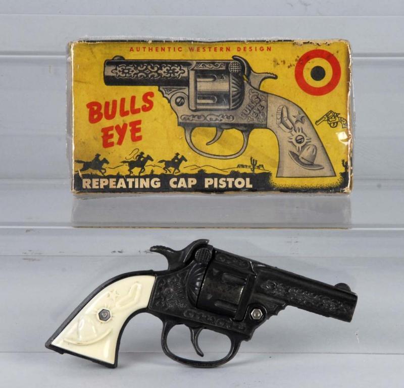 Appraisal: Cast Iron Kenton Bulls Eye Cap Gun Description Includes box