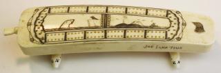 Appraisal: th c Alaskan walrus tusk ivory cribbage board w carved