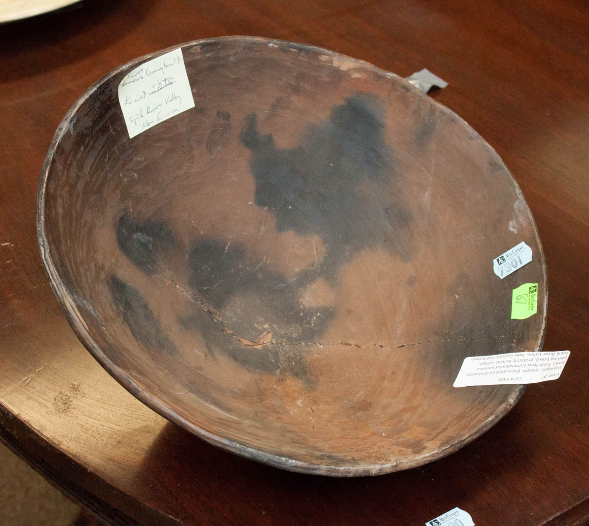 Appraisal: Decorated earthenware bowl Condition Broken and repaired with some losses