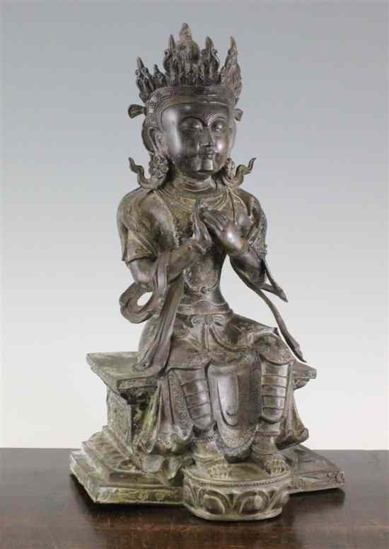 Appraisal: A Chinese bronze seated figure of a Bodhisattva on a