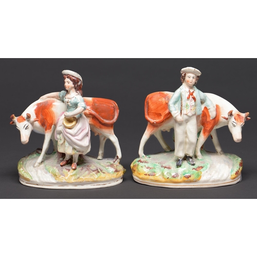 Appraisal: A pair of Staffordshire earthenware figures of a farmer and