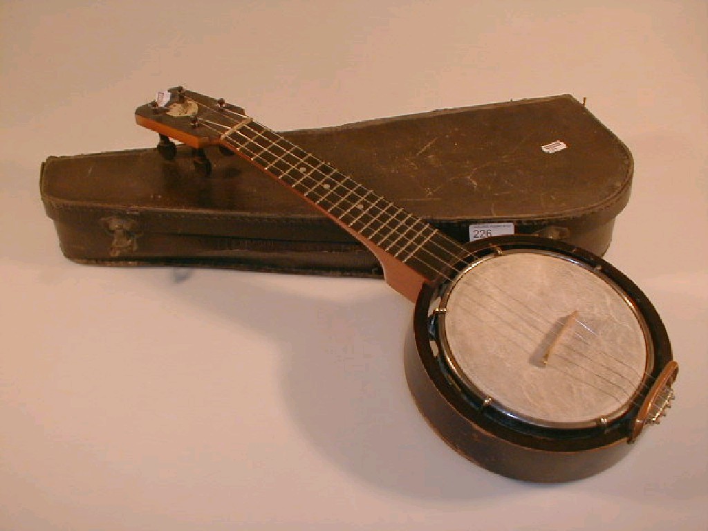 Appraisal: A cased Keech Banjulele banjo